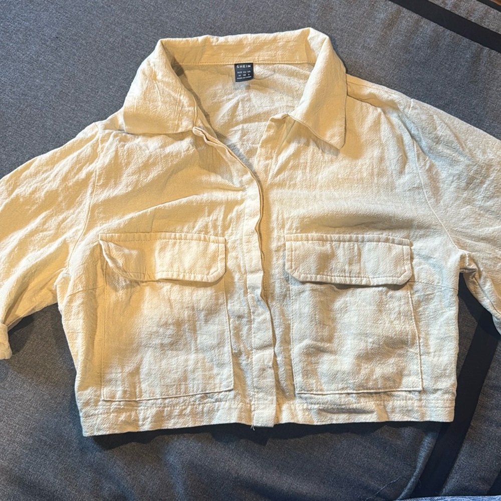 Never worn flap pocket. Crop shirt.